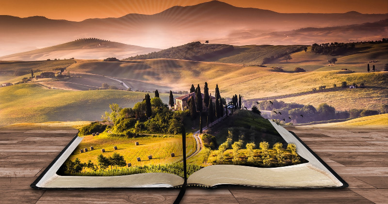 Freies Lernen und menschliches Wachsen durch Austausch von Erfahrungen und Entwickeln von neuem. Bild zeigt ein aufgeschlagenes Buch, aus dem eine phantastische und malerische Landschaft erwächst.